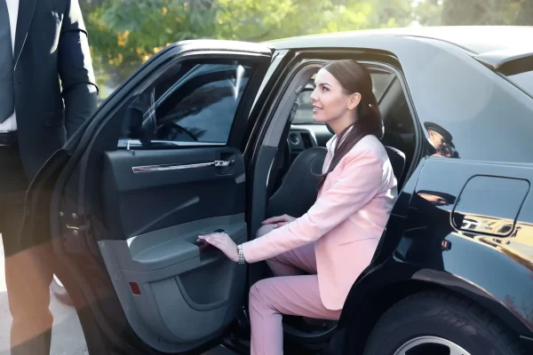 Businesswoman in luxury car